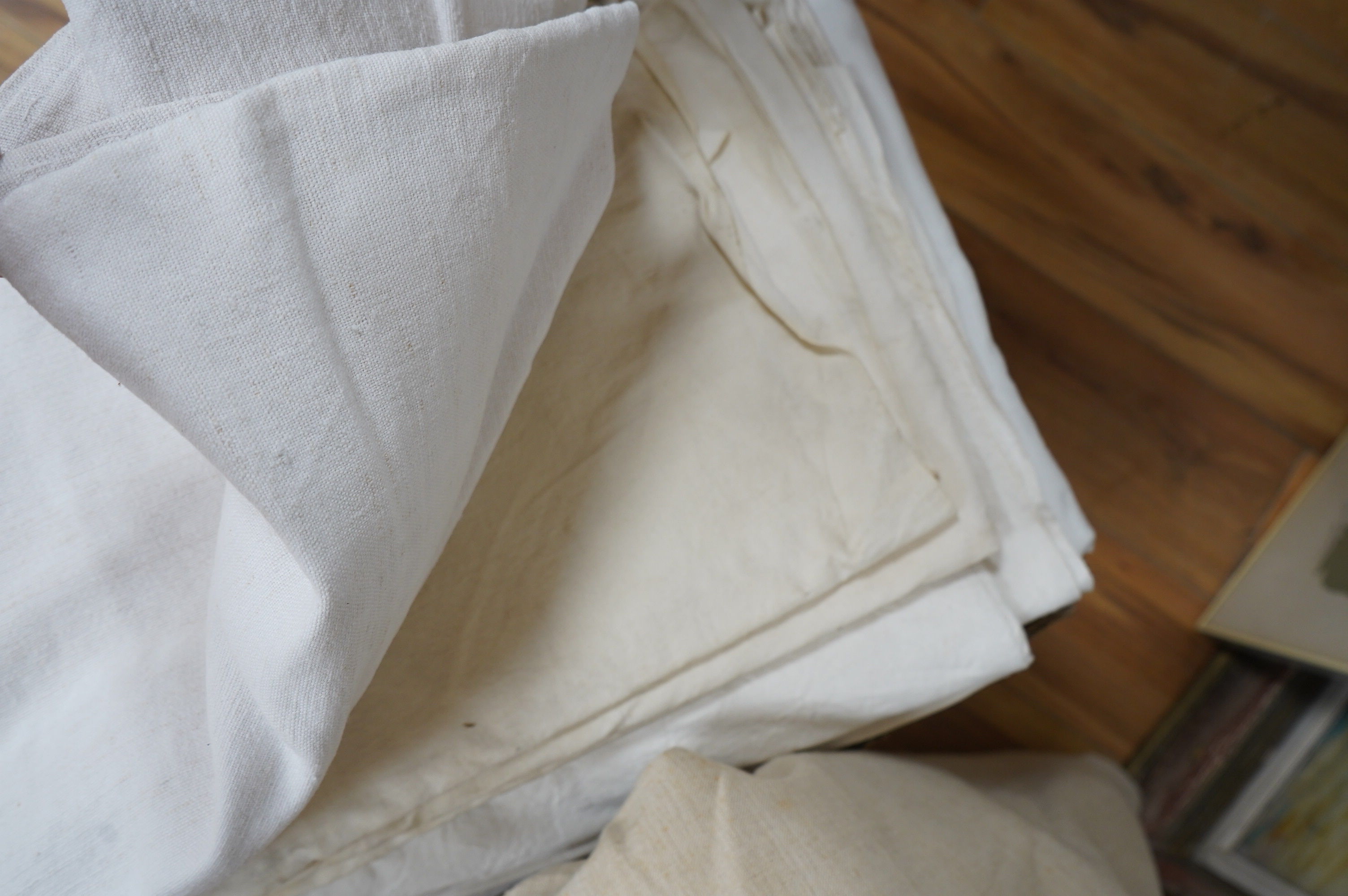 Sixteen French provincial coarse linen sheets, together with a similar roll of approximately 10 meters. Condition - variable